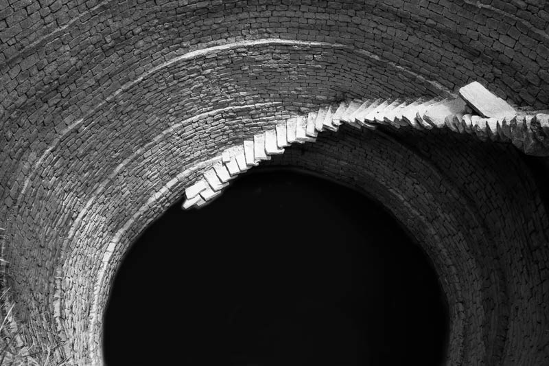 Traditional water supply science and technology of India - circular stepwell in a village in Kolar district, Karnataka, an area known to be drought-prone with a semi-arid climate